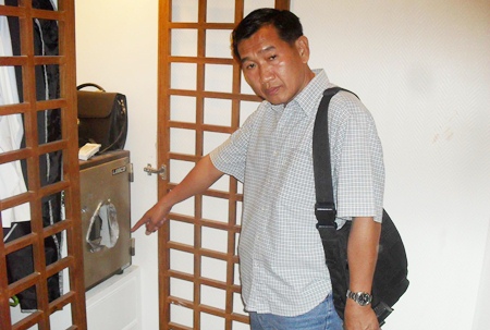 Police Lt. Col. Tarathep Tupanit inspects the scene of the crime.